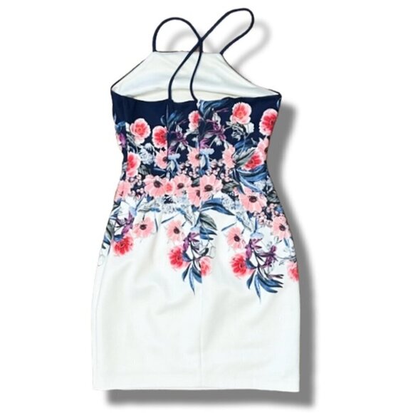 A strappy back adds allure to an apron-front bodycon dress wrapped in flowers - - Picture 4 of 5